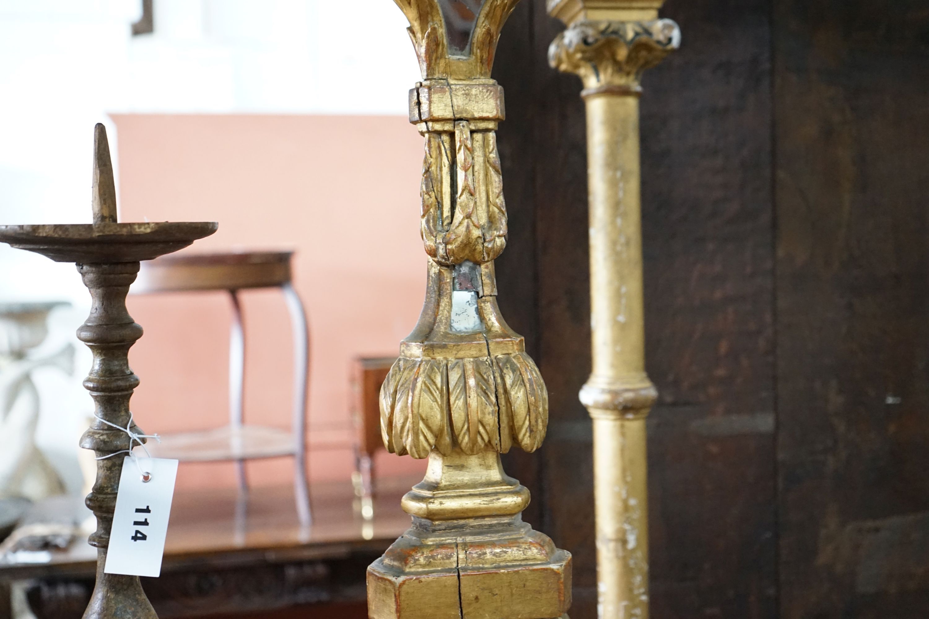 Two 18th century style Italian giltwood altar sticks, larger height 82cm